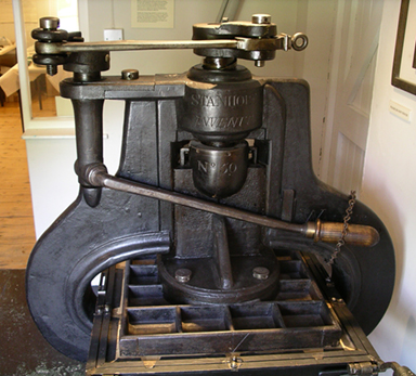 The second and more common design of the Stanhope hand press. Note the separation of the lever system from the screw and platen mechanism. 